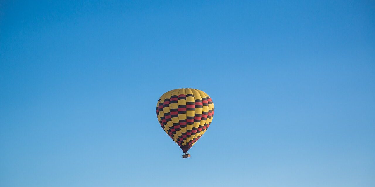 Hot air balloon over the clear up-valley sky in the Napa Valley