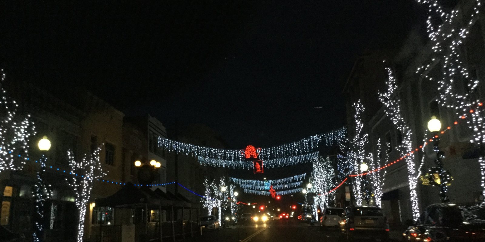 Downtown Vallejo strung with holiday lights across the street at night