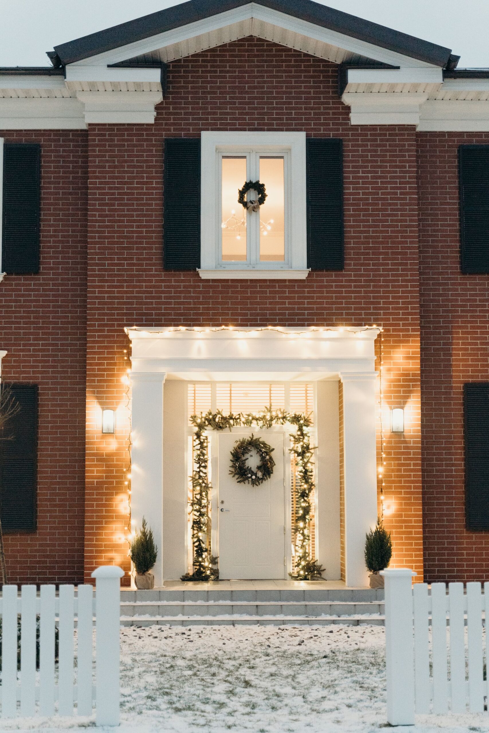 House entry with festive wreath and warm lighting