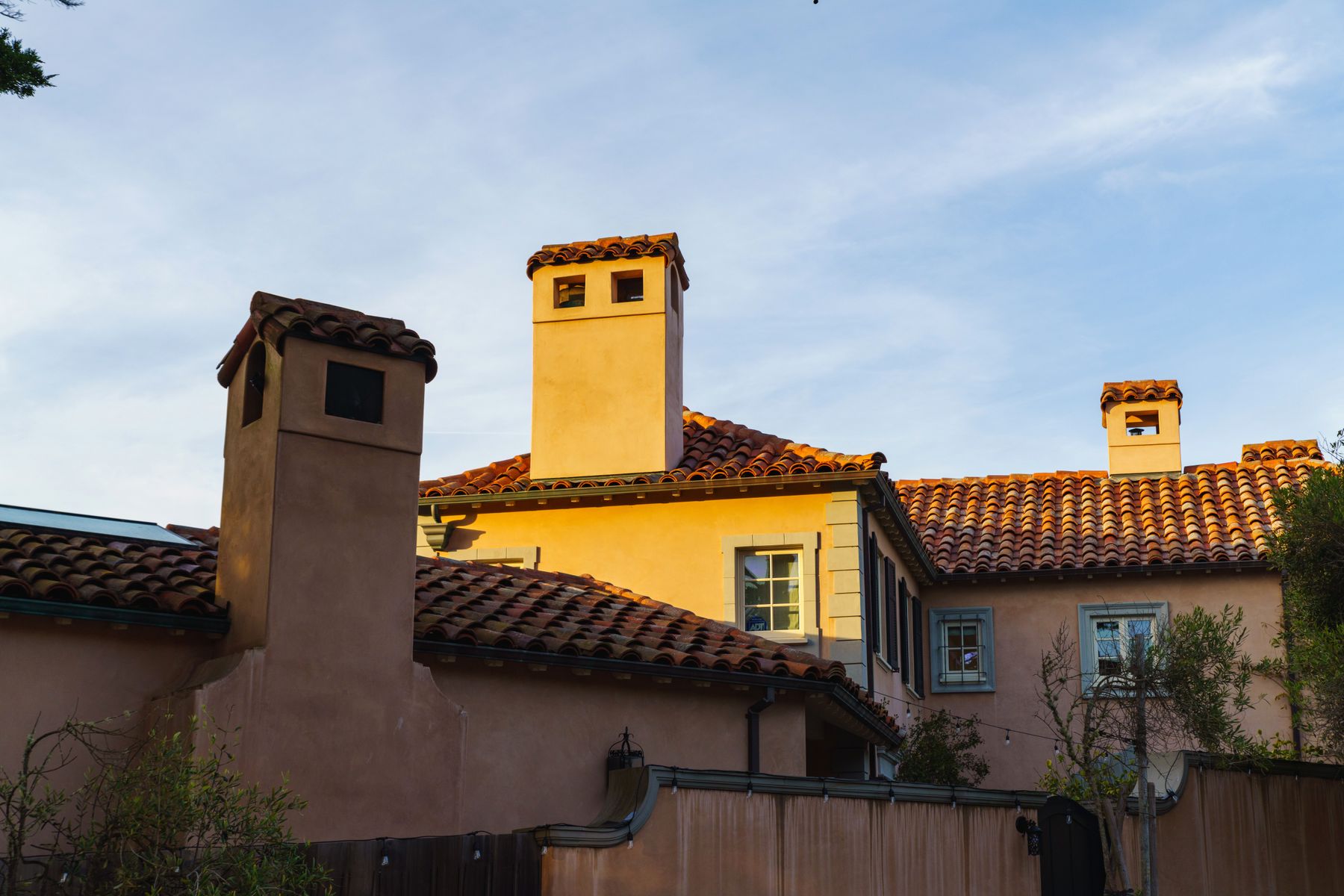 Mediterranean-style home with red barrel tile roof